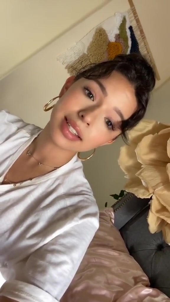 Angela Aguilar on bed…